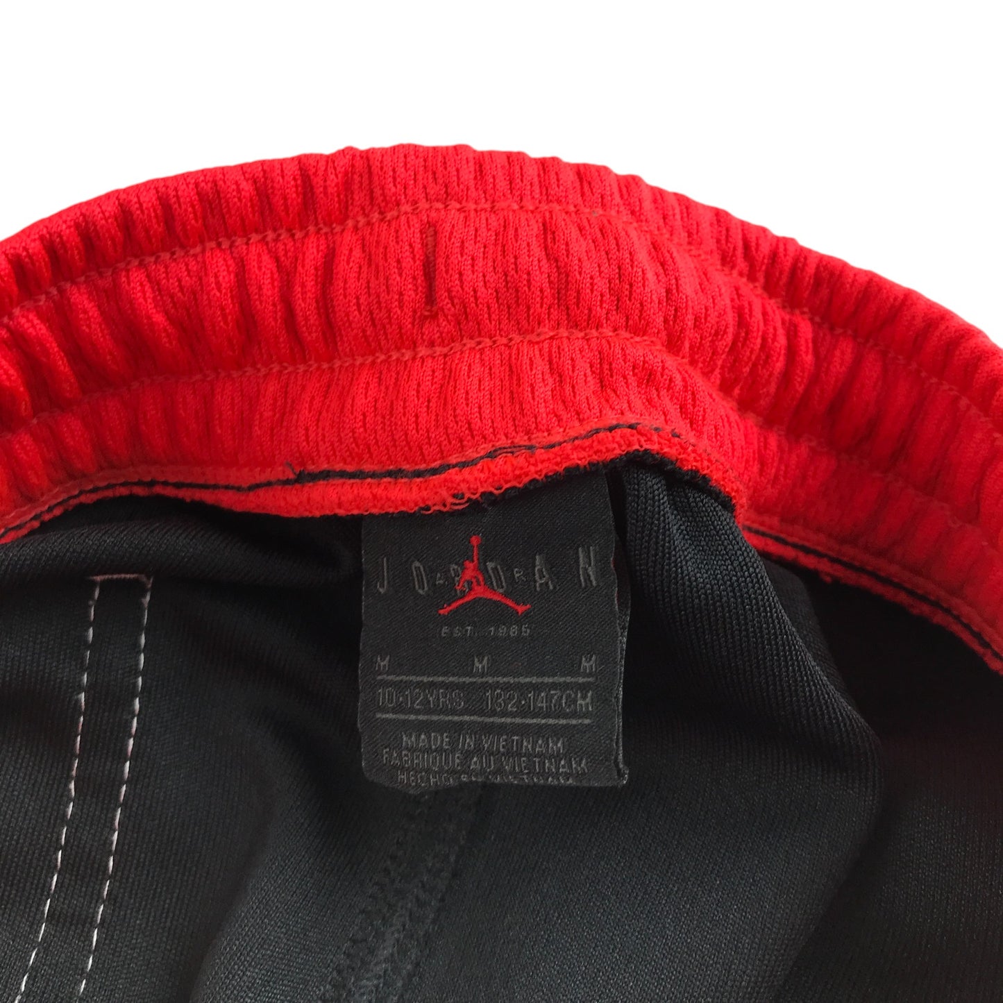 Jordan sports shorts 9-10 years black with red waistband and logos