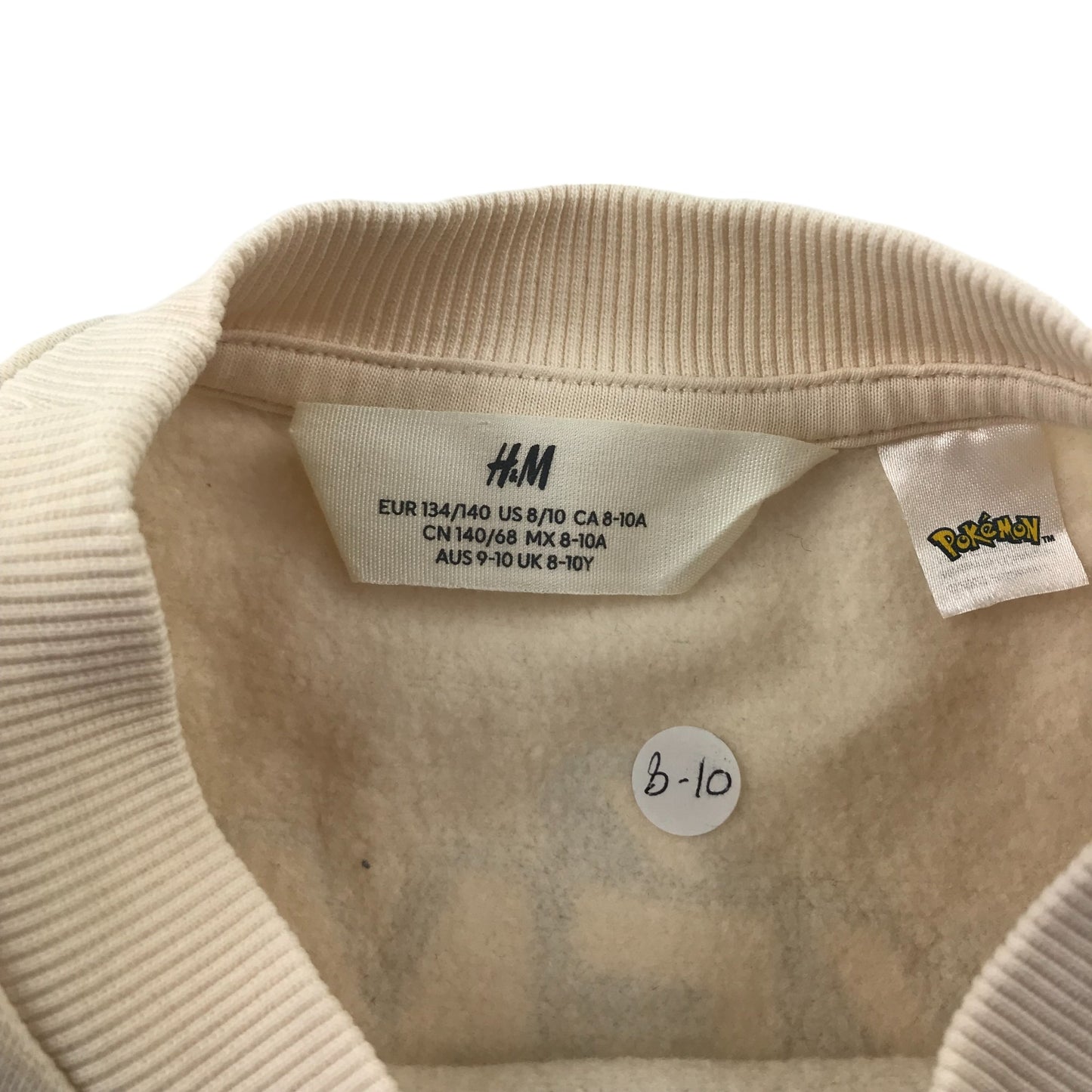 H&M sweater 9-10 years beige Mewtwo Pokemon master ball graphic print