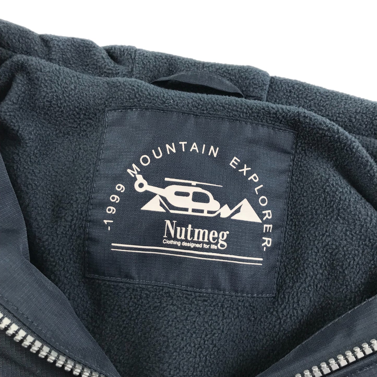 Nutmeg light jacket 8-9 years navy plain jacket with cuffed arms and waist fleece lining