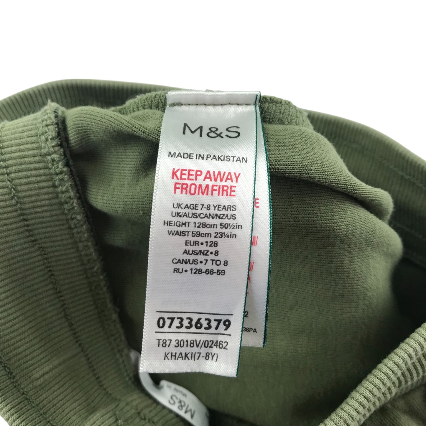 M&S shorts 7-8 years khaki with black strip both sides jersey material