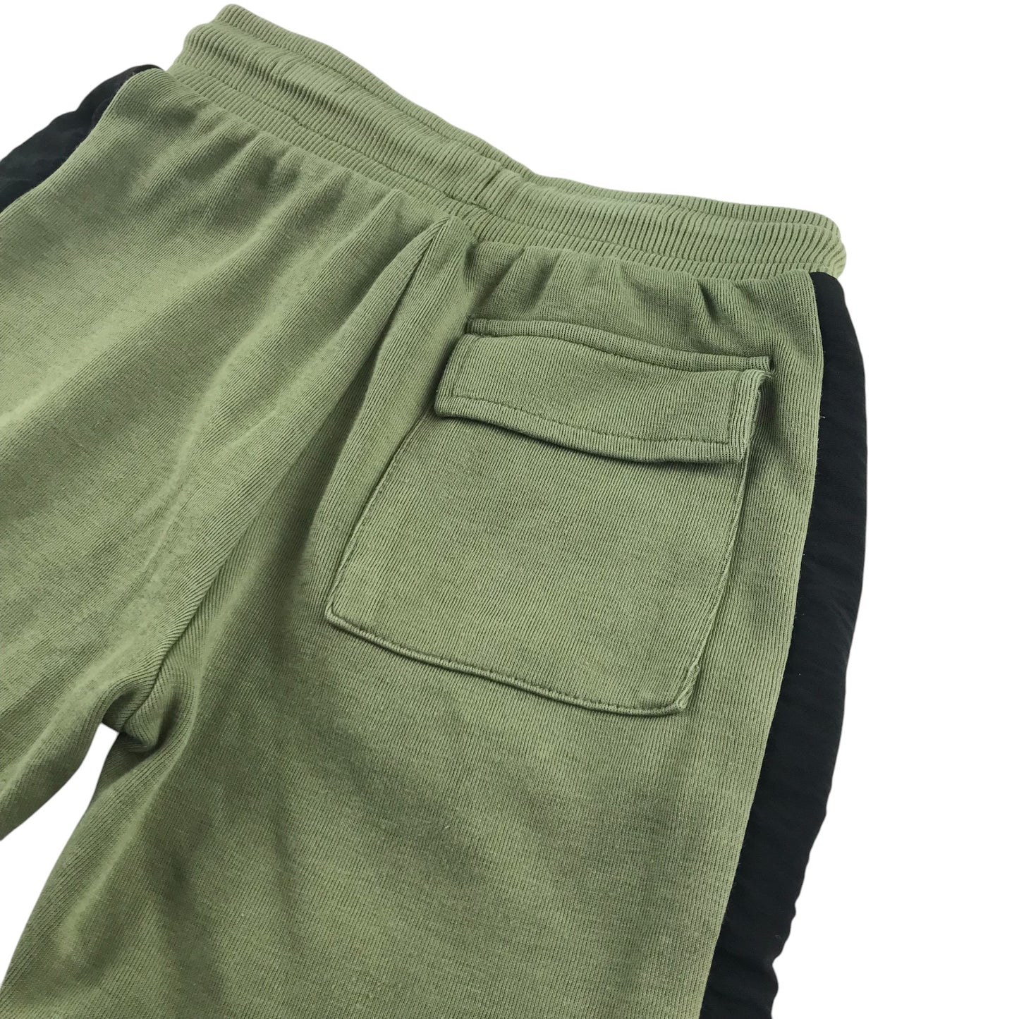 M&S shorts 7-8 years khaki with black strip both sides jersey material