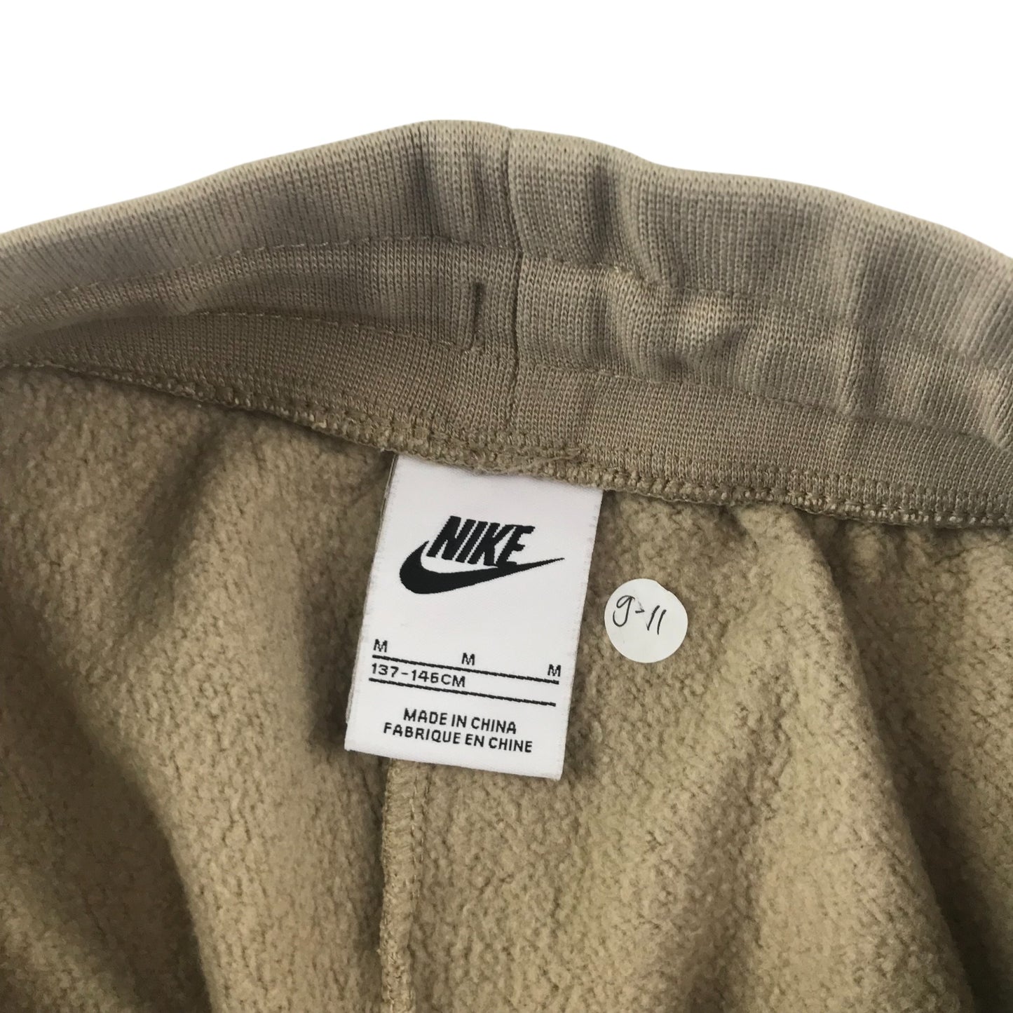 Nike joggers 9-10 years beige plain with small logo cuffed legs