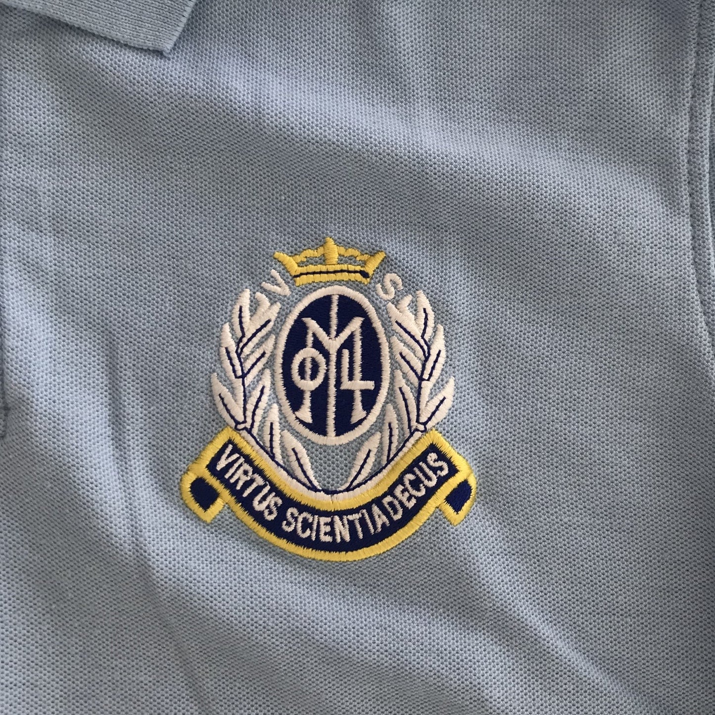 Our Lady of the Missions Primary light blue polo shirt