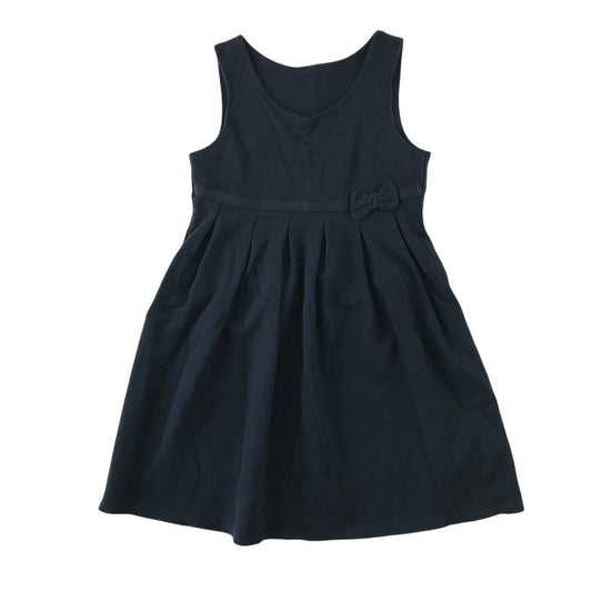 Front and back views of a second-hand girls navy blue jersey pinafore school dress