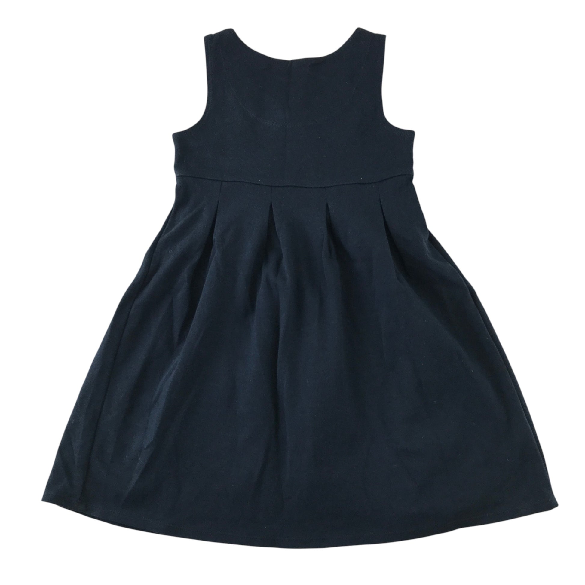 Front and back views of a second-hand girls navy blue jersey pinafore school dress
