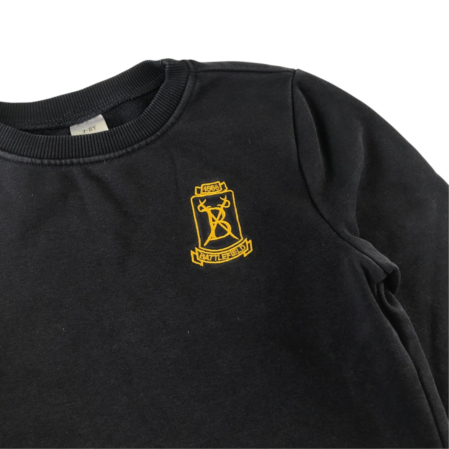 Second-hand Battlefield Primary School navy jersey crewneck, flat lay view with embroidered badge.