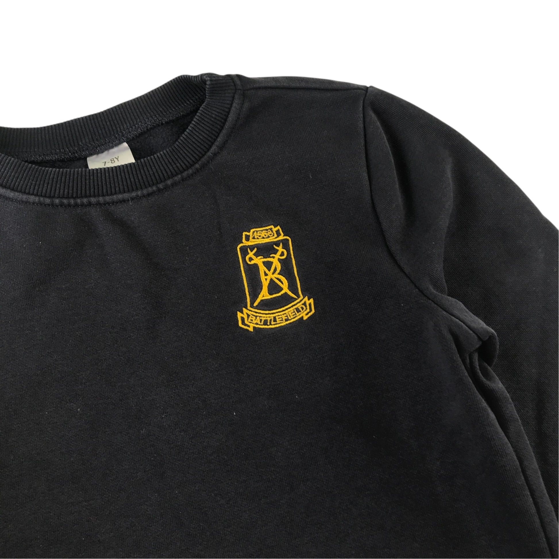 Second-hand Battlefield Primary School navy jersey crewneck, flat lay view with embroidered badge.