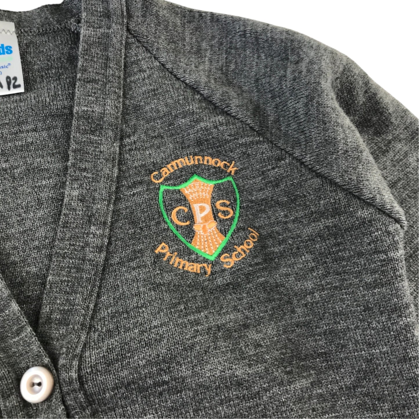 Second-hand Carmunnock Primary girls light grey knitwear school cardigan, flat lay view with embroidered badge.