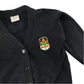 Second-hand Broomhill Primary girls navy jersey school cardigan, flat lay view with embroidered school badge.