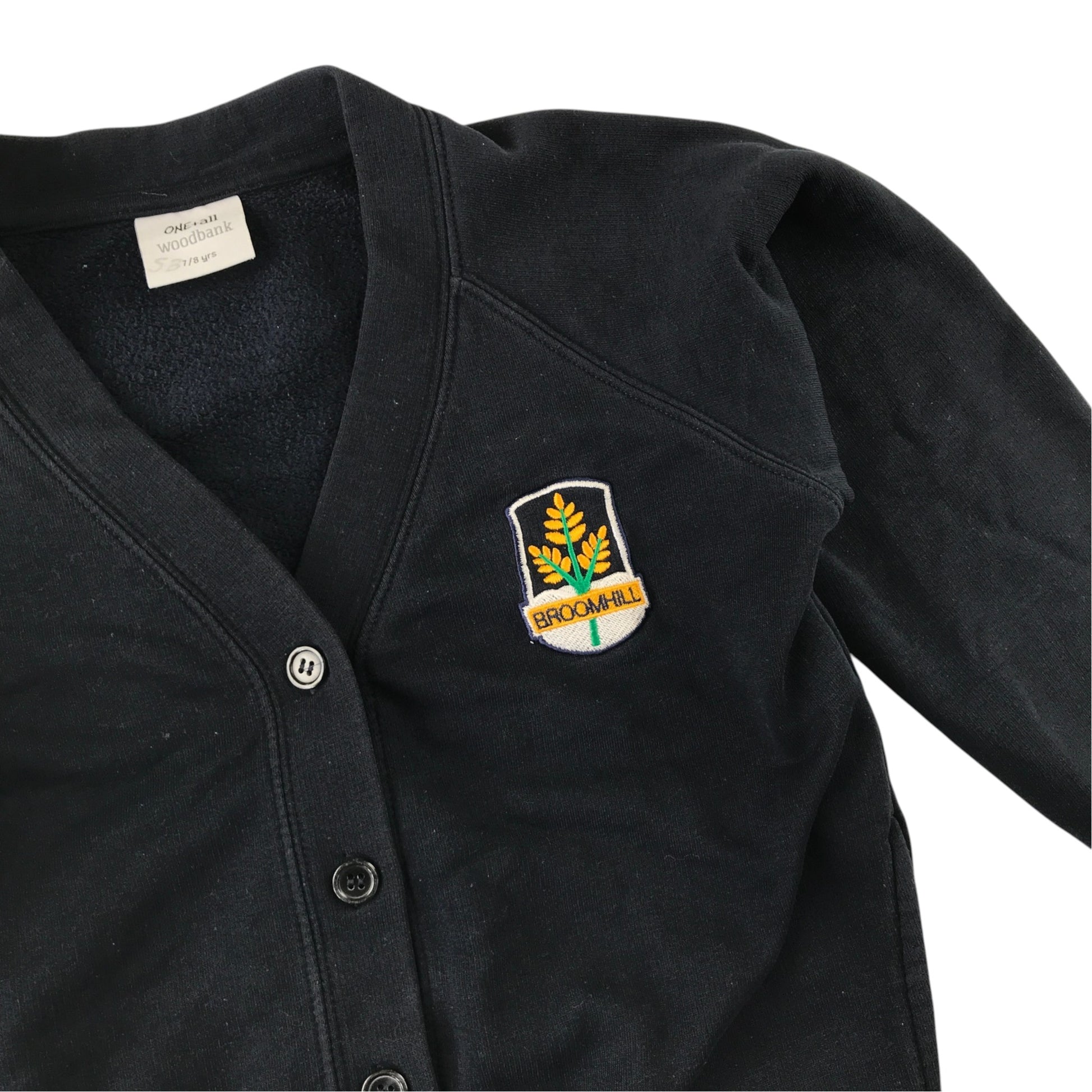 Second-hand Broomhill Primary girls navy jersey school cardigan, flat lay view with embroidered school badge.