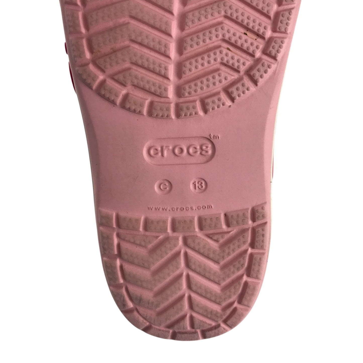 Crocs shoe size 13 junior pink with red stripe and text logo