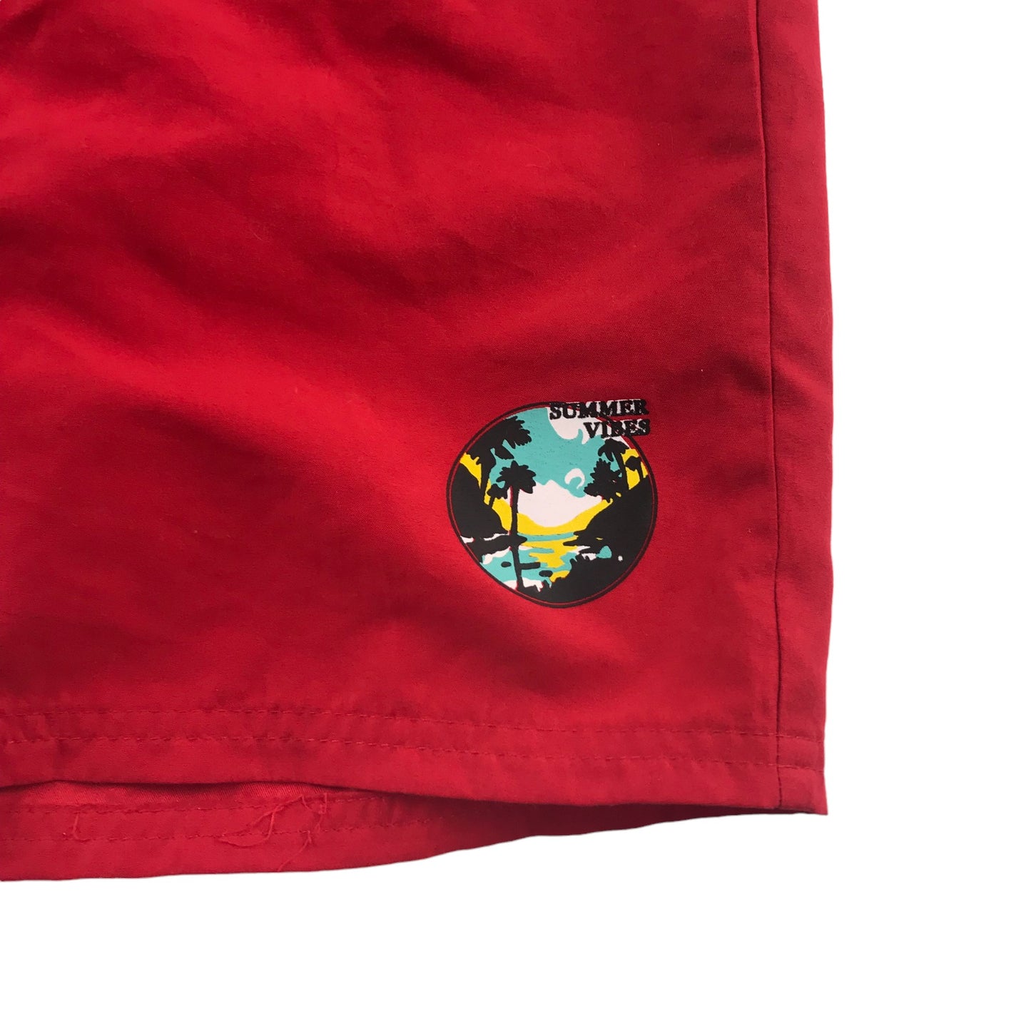 Tissaia swim trunks 10 years red plain with small circle graphic