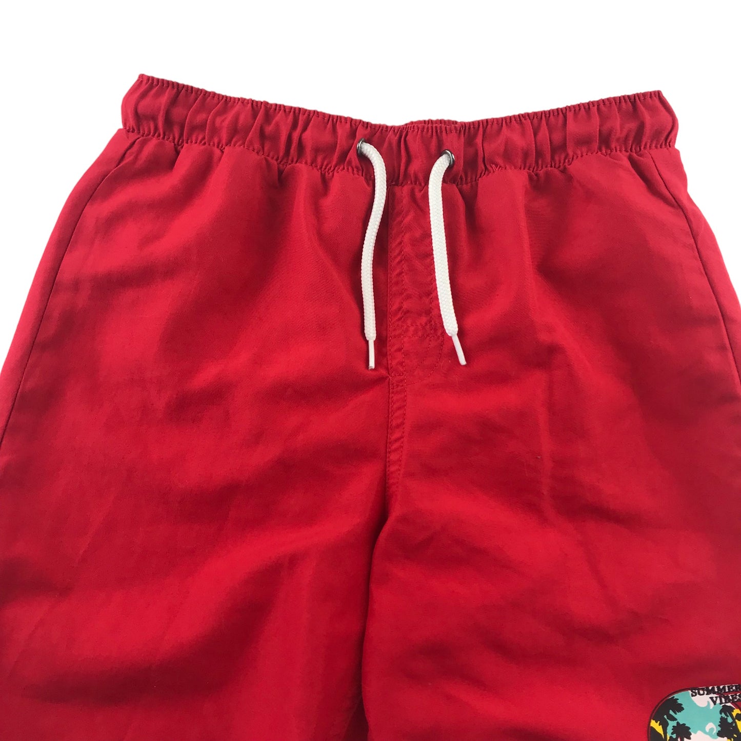 Tissaia swim trunks 10 years red plain with small circle graphic