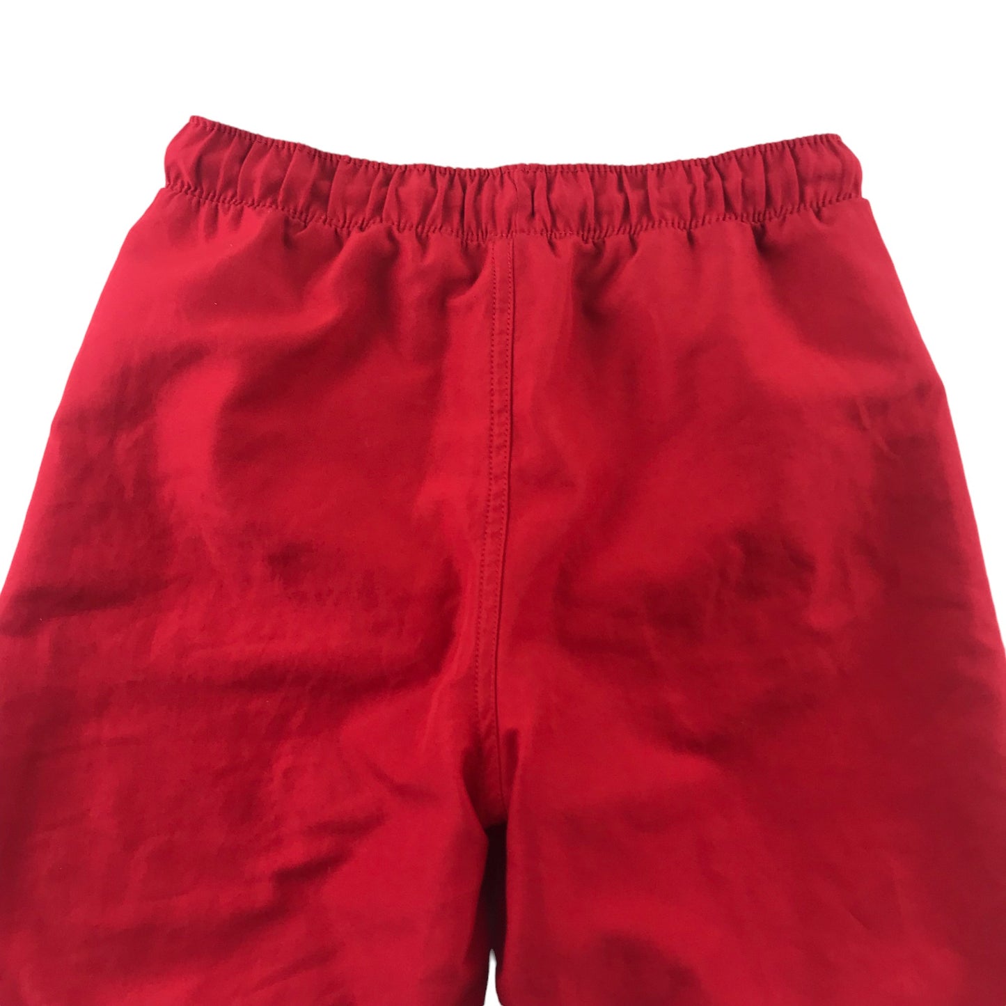 Tissaia swim trunks 10 years red plain with small circle graphic