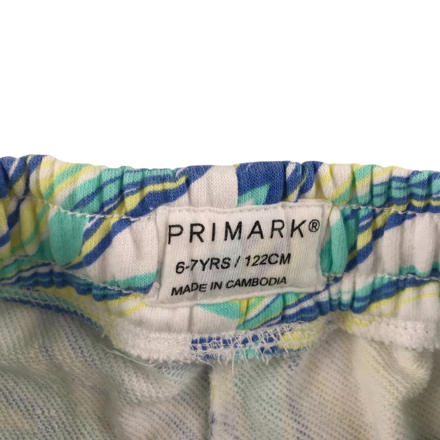 Primark shorts 6-7 years white jersey with wavey graphic design