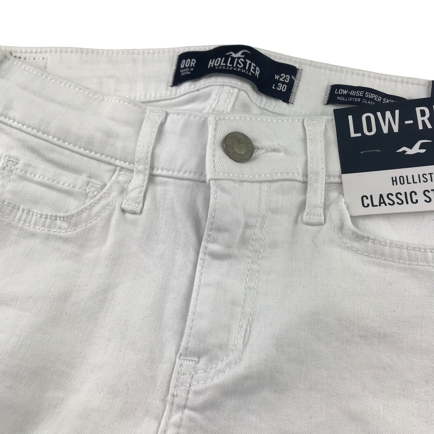 Hollister jeans W23 L30 11-12 years long white low rise long leg stretchy with worn effect