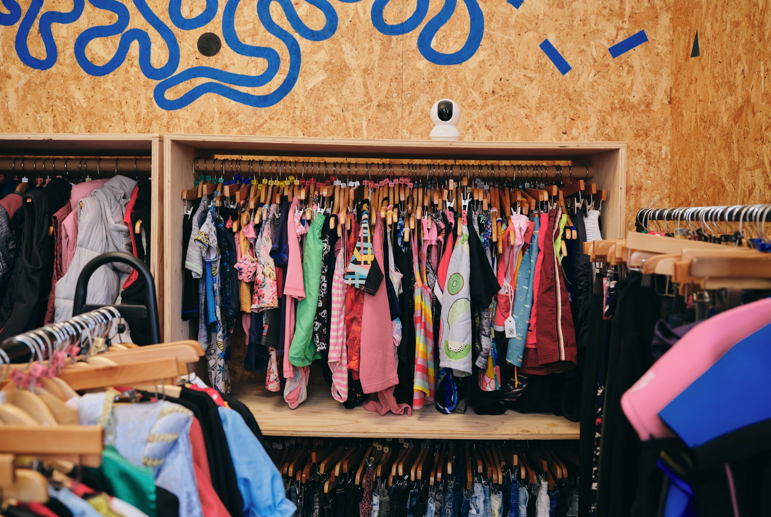 Secondhand kids clothing on rails