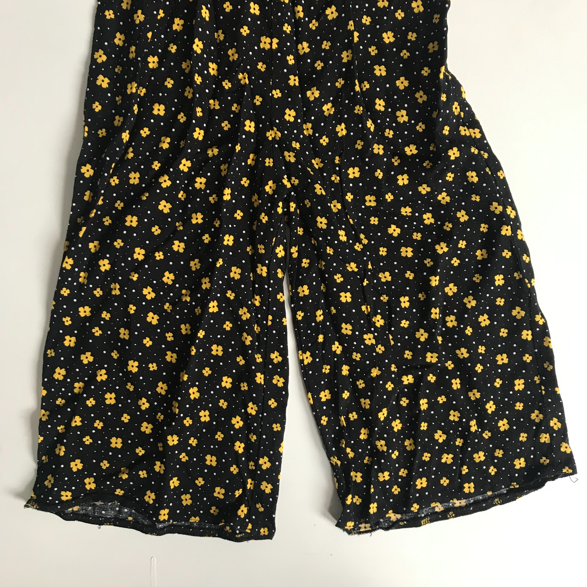 Black jumpsuit with yellow flowers sales
